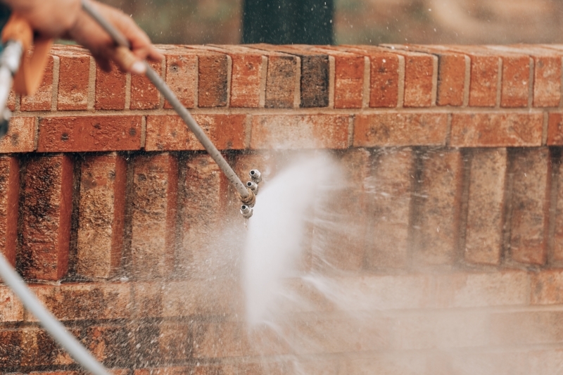 Pressure washing close up brick soft washing
